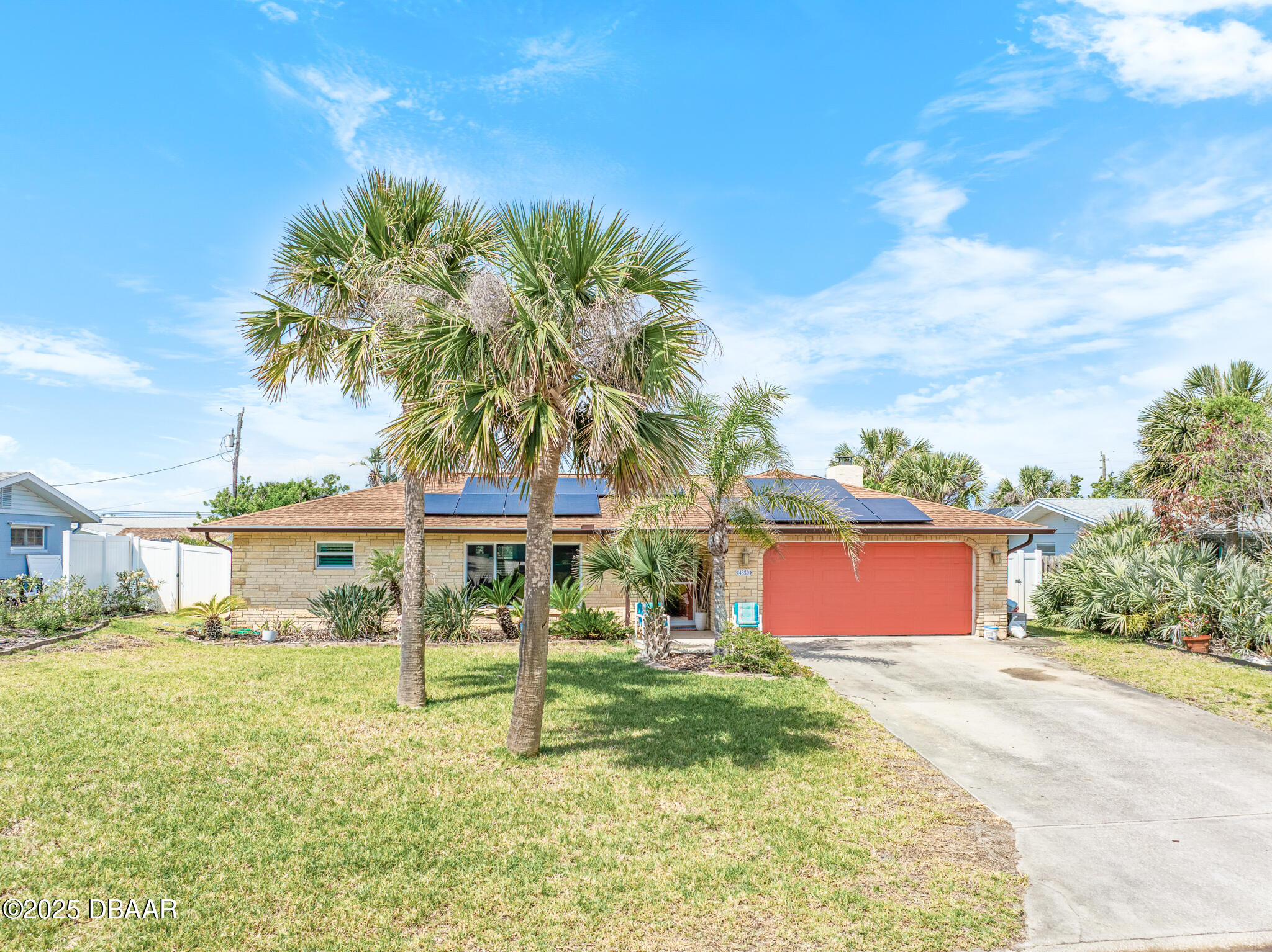 4350 Candlewood Lane Ponce Inlet, FL 32127 - Photo 1 of 60 a front view of a house with garden
