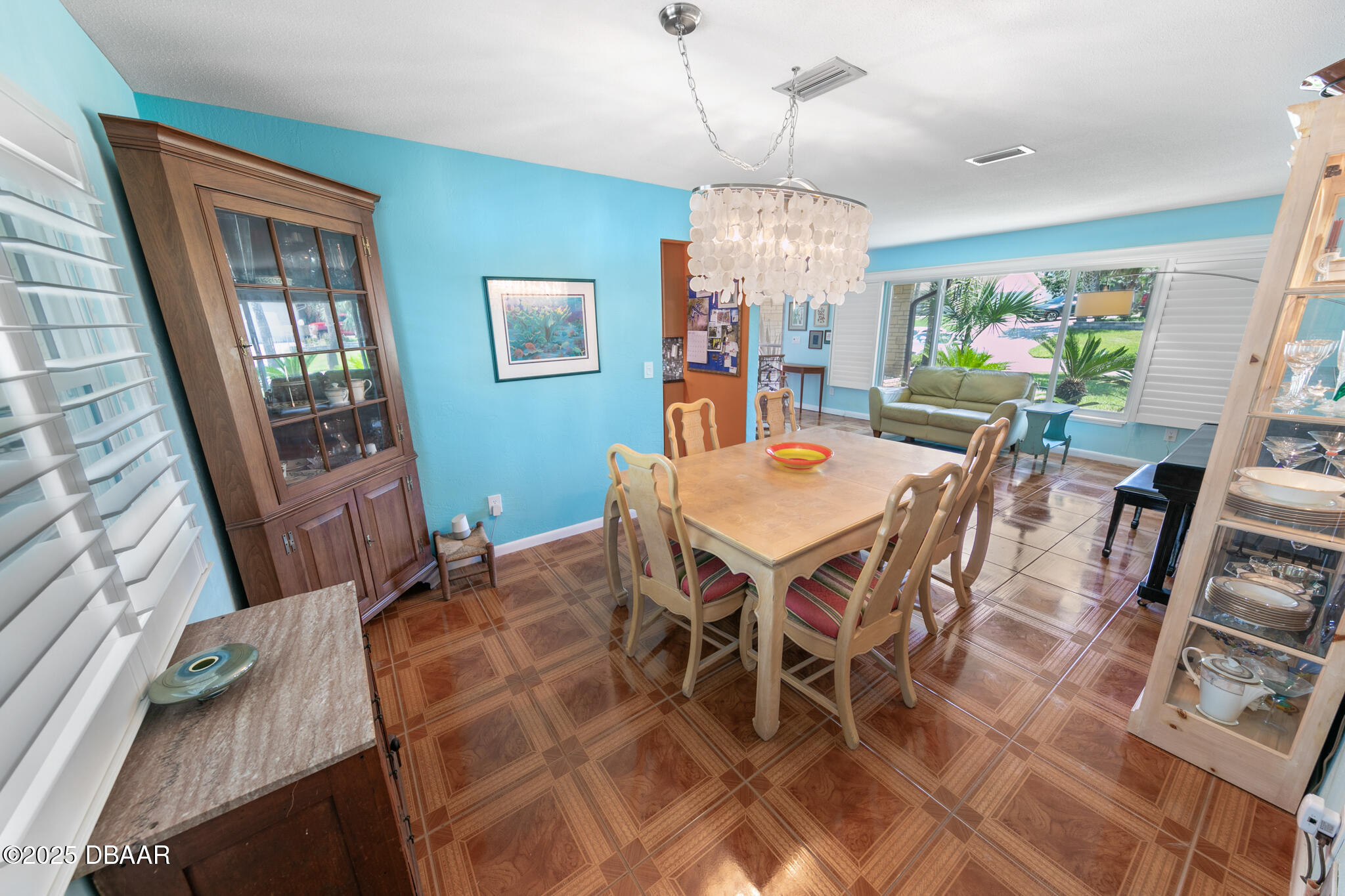 4350 Candlewood Lane Ponce Inlet, FL 32127 - Photo 16 of 60 a view of a dining room with furniture window and wooden floor