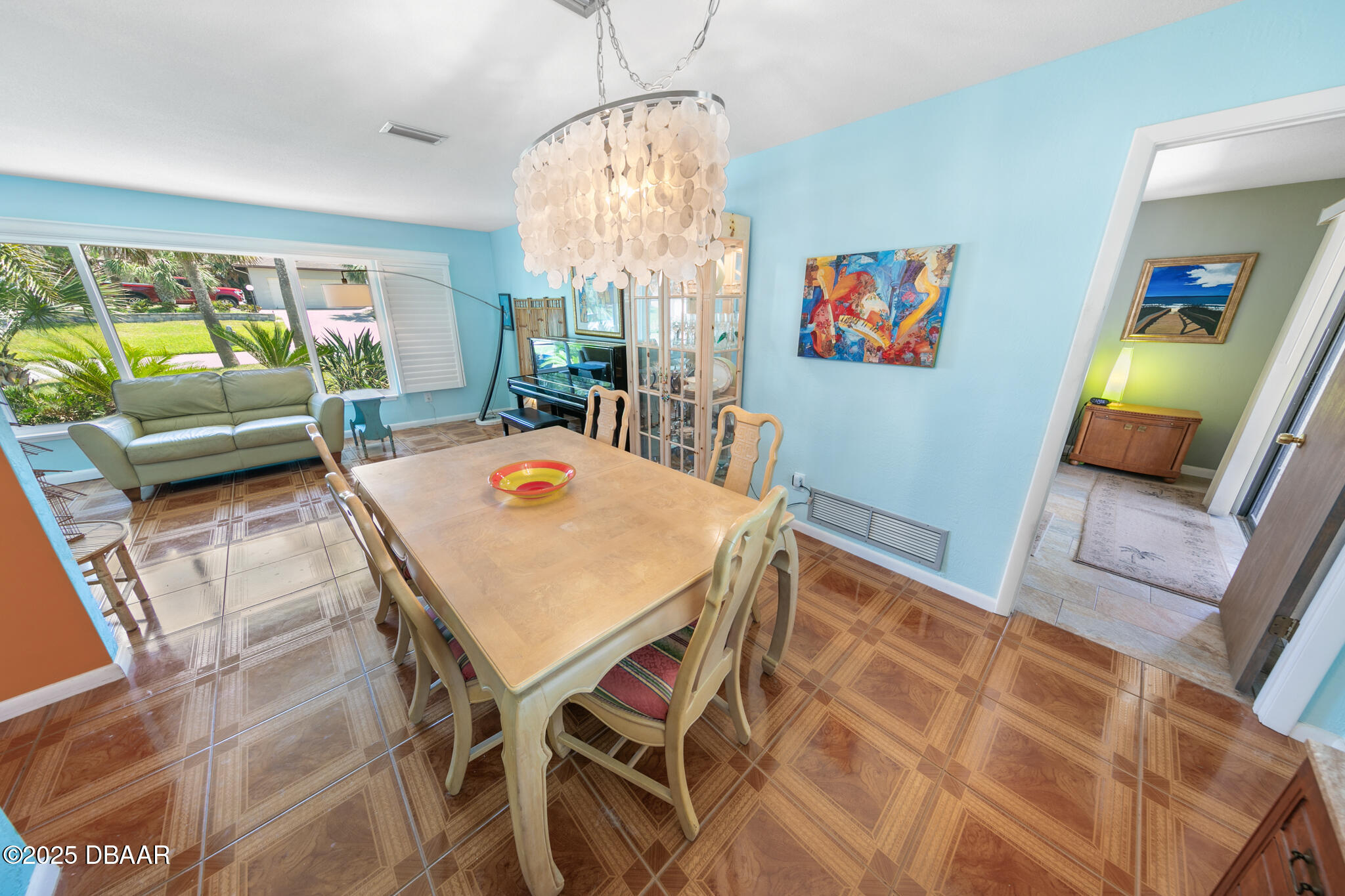 4350 Candlewood Lane Ponce Inlet, FL 32127 - Photo 17 of 60 a view of a dining room with furniture and a chandelier