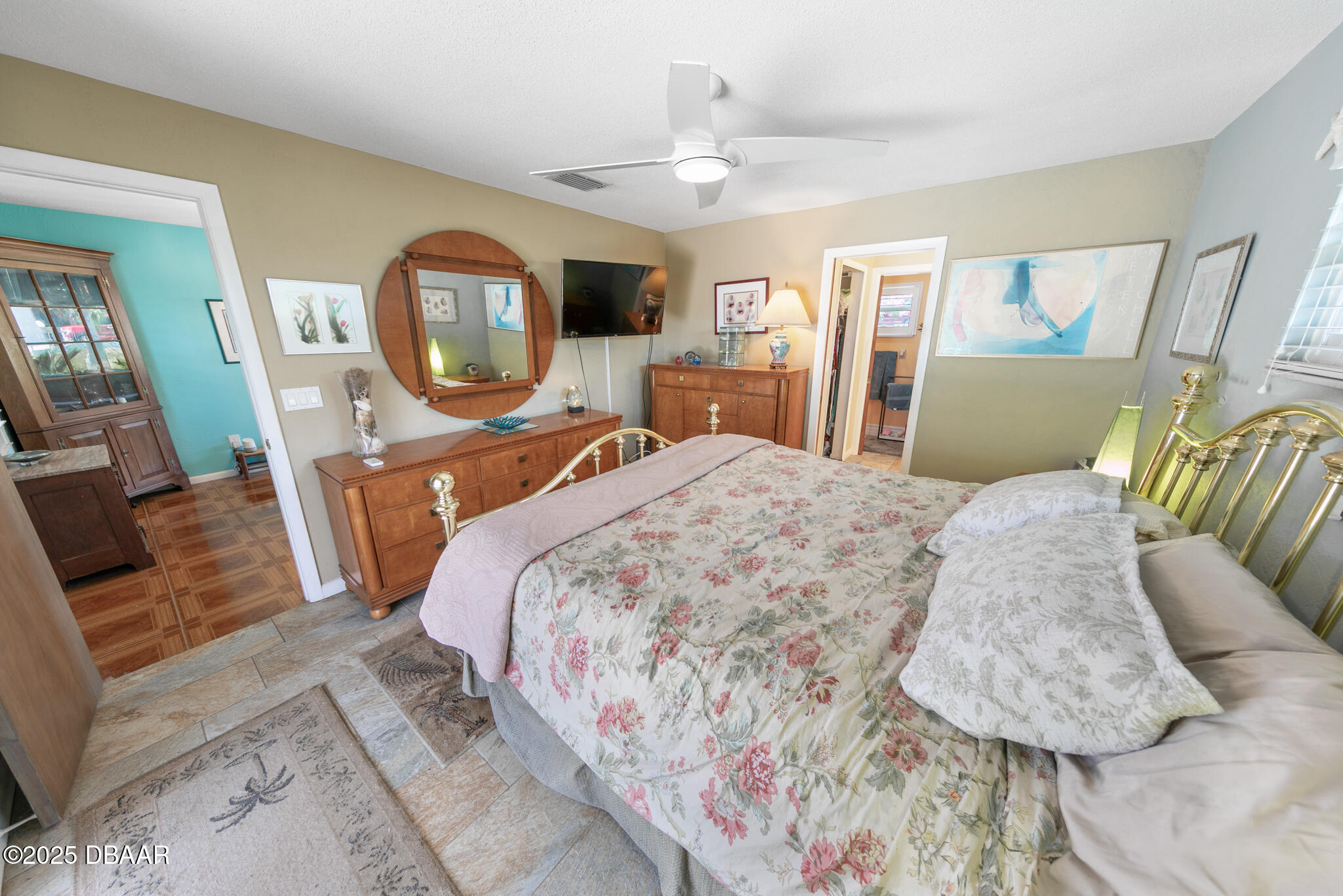 4350 Candlewood Lane Ponce Inlet, FL 32127 - Photo 24 of 60 a bed sitting in a bedroom next to a window