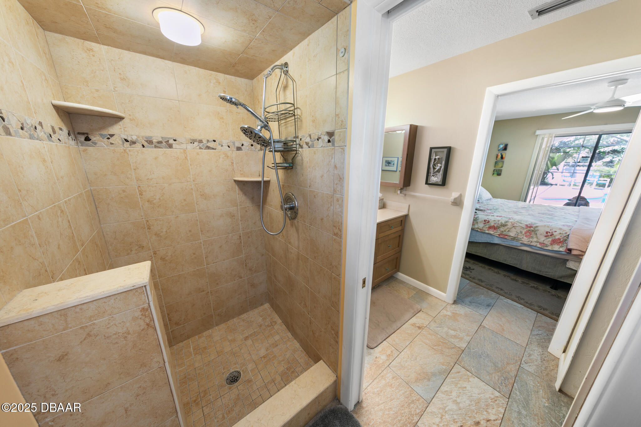 4350 Candlewood Lane Ponce Inlet, FL 32127 - Photo 27 of 60 a bathroom with a glass shower door and a sink