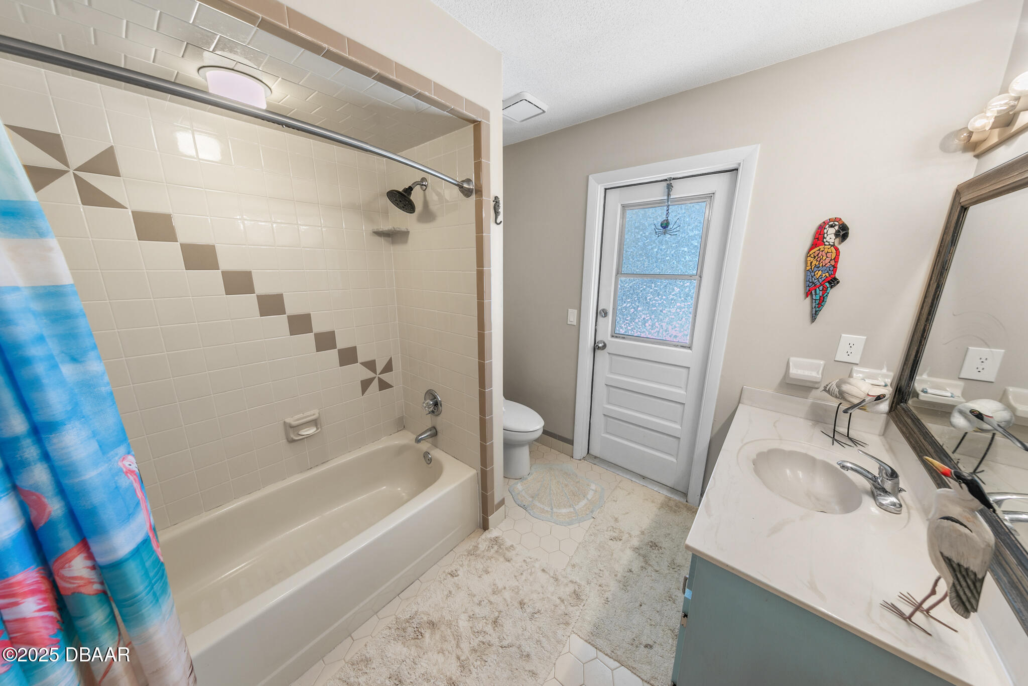 4350 Candlewood Lane Ponce Inlet, FL 32127 - Photo 32 of 60 a bathroom with a sink a toilet and a bathtub
