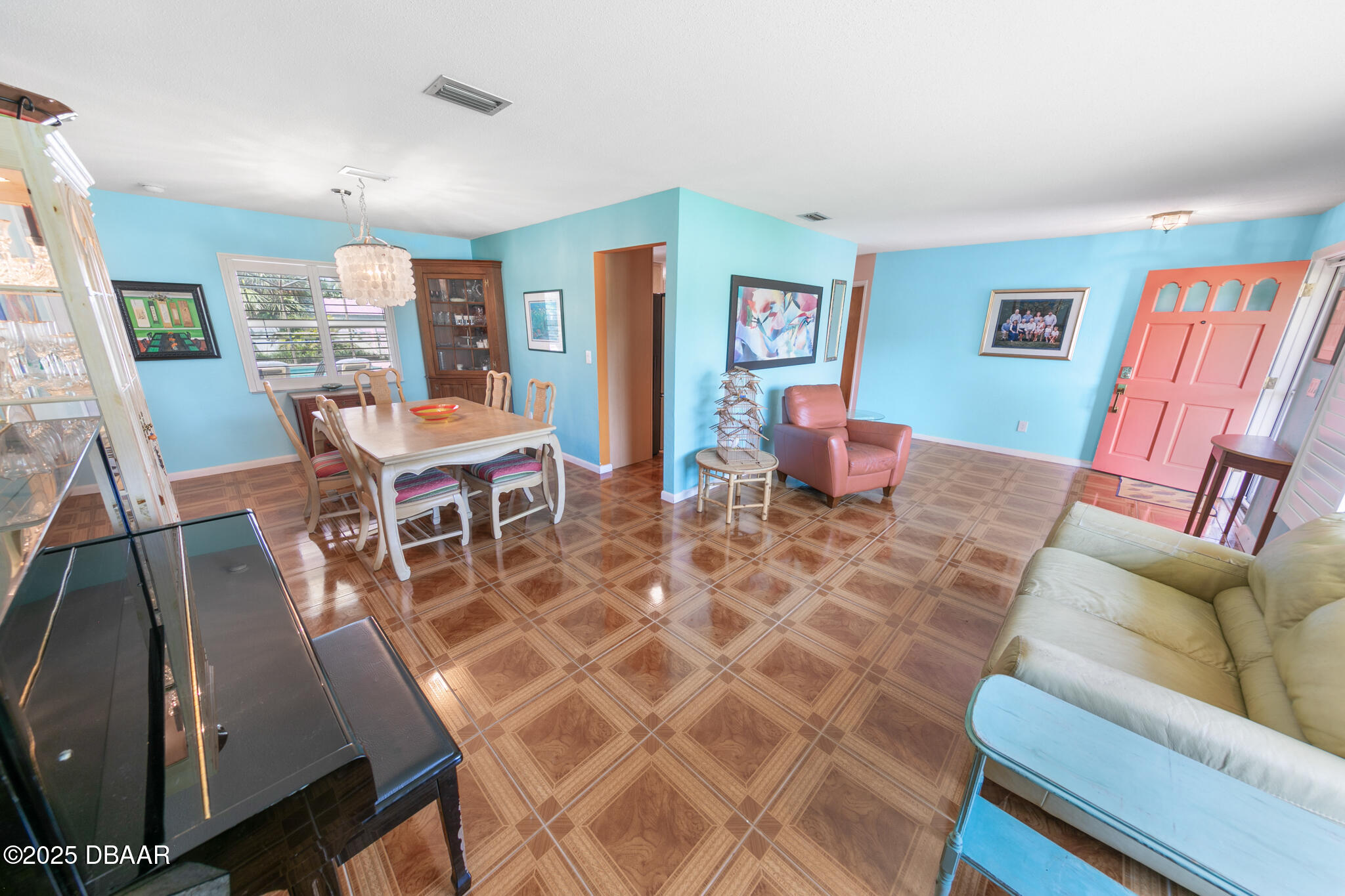 4350 Candlewood Lane Ponce Inlet, FL 32127 - Photo 5 of 60 a living room with furniture a wooden floor and a window