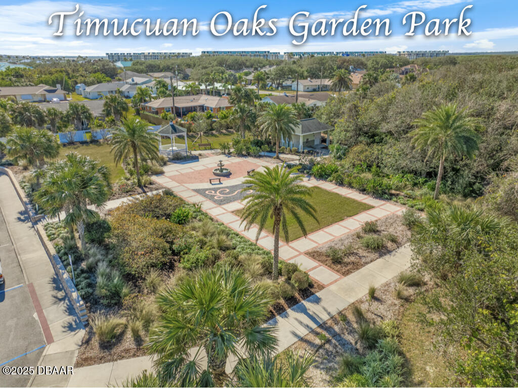 4350 Candlewood Lane Ponce Inlet, FL 32127 - Photo 51 of 60 a view of outdoor space with garden and signage
