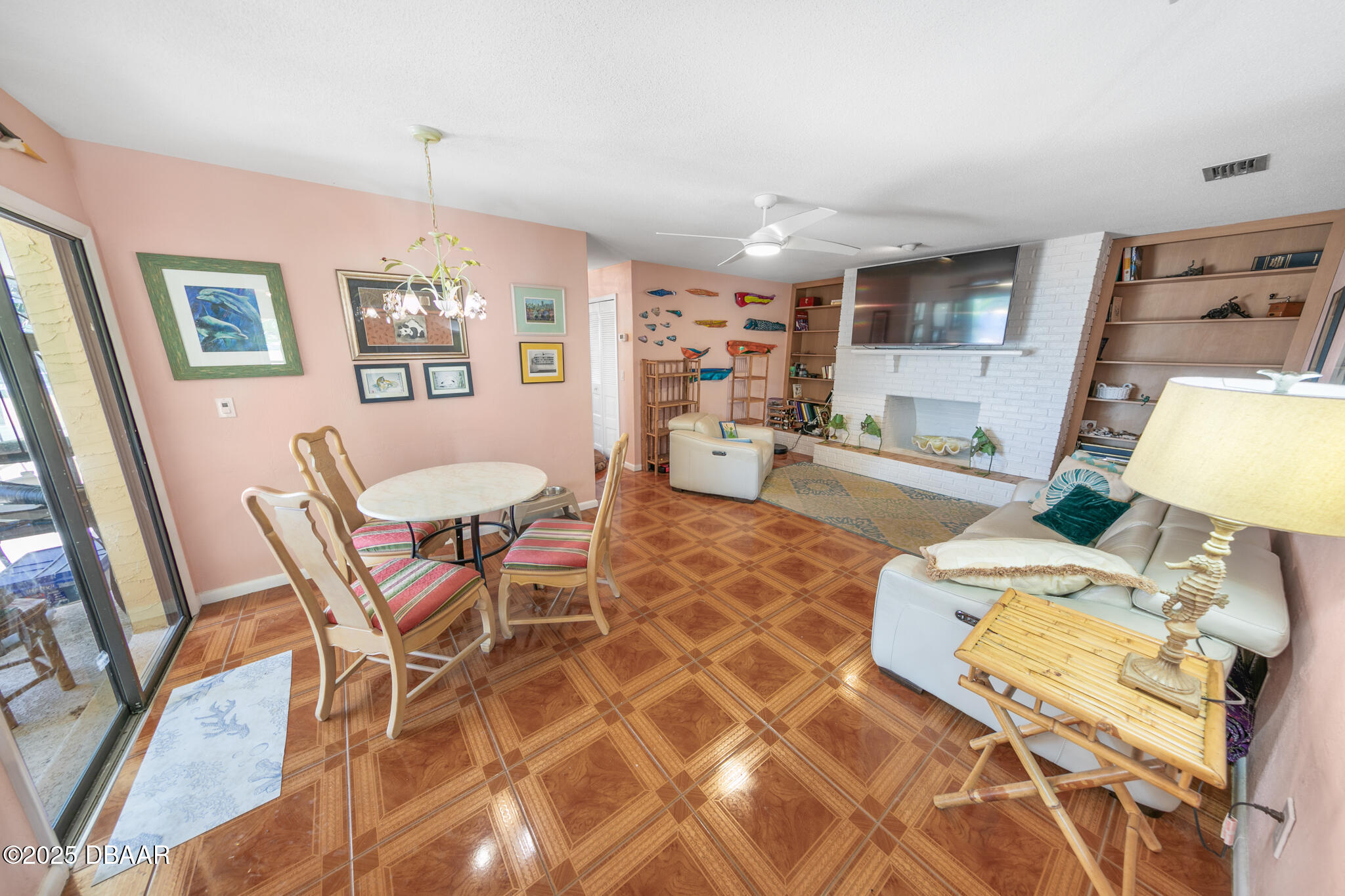 4350 Candlewood Lane Ponce Inlet, FL 32127 - Photo 10 of 60 a room with furniture a flat screen tv and a table