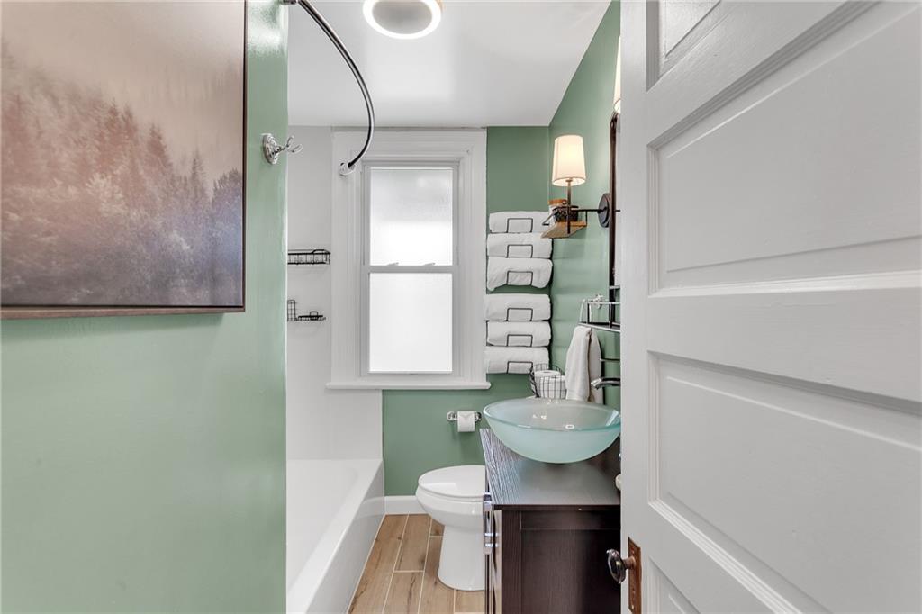 713 Clinton Place Pittsburgh, PA 15202 - Photo 14 of 31 a bathroom with a toilet a sink and shower