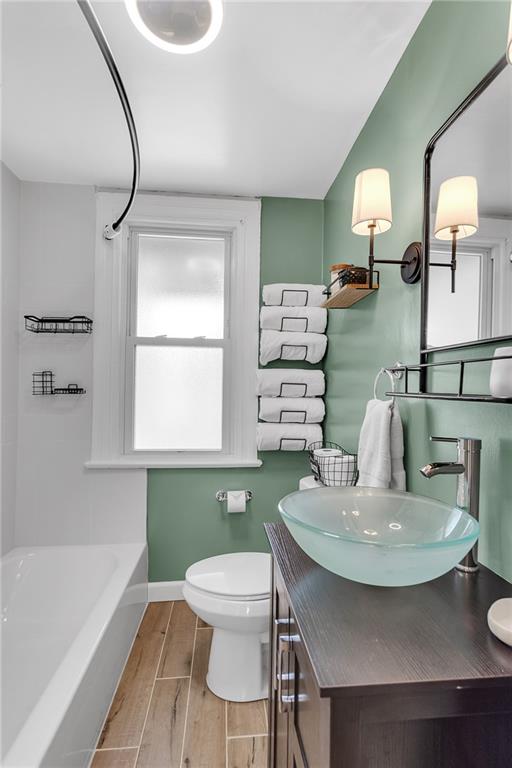713 Clinton Place Pittsburgh, PA 15202 - Photo 15 of 31 a kitchen with a table chairs and a wooden floor