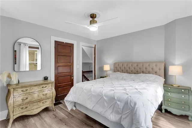 a bedroom with a bed and a dresser