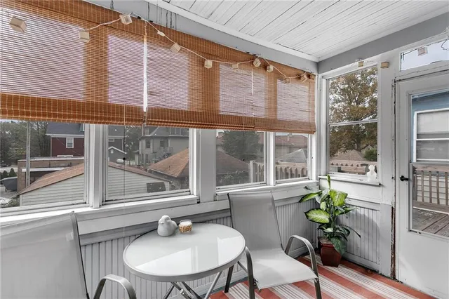 a room with furniture and a potted plant