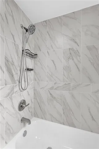 a bathroom with a bath tub