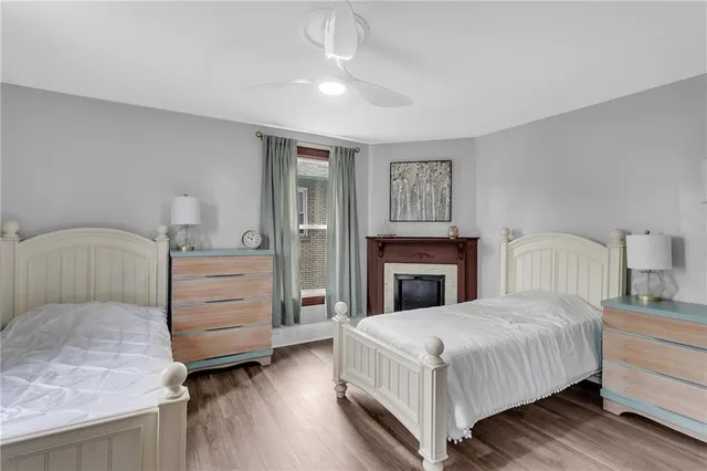 a bedroom with a large bed and a dresser