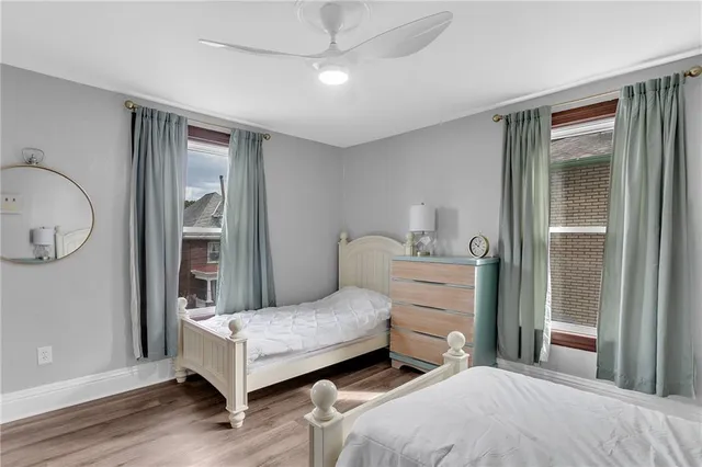 a bedroom with a bed and a mirror