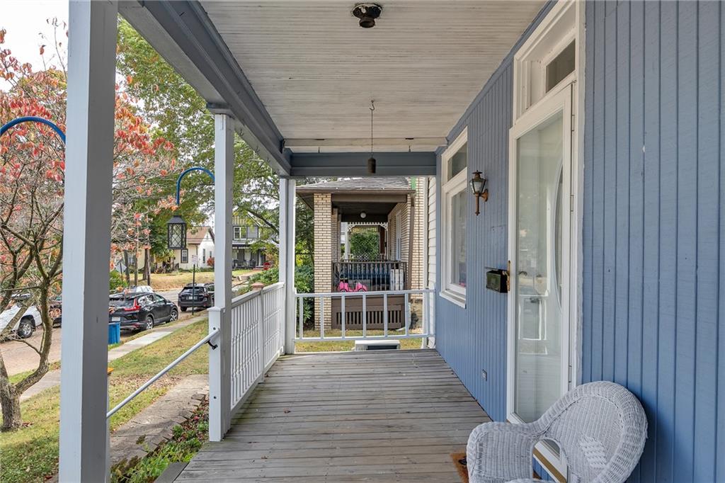 713 Clinton Place Pittsburgh, PA 15202 - Photo 4 of 31 a view of a porch with wooden floor and outdoor seating