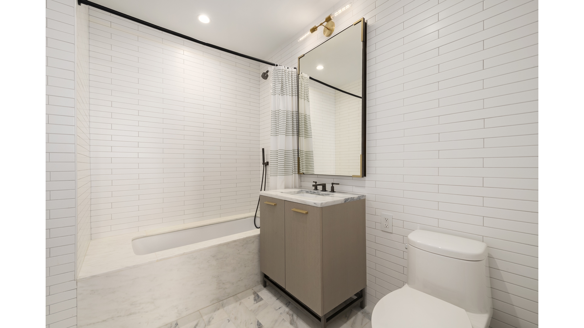 91 Leonard Street, Unit PH1 Manhattan, NY 10013 - Photo 9 of 25 a bathroom with a toilet a sink and bathtub