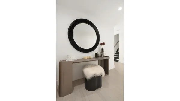 a bathroom with a granite countertop sink a toilet and a mirror