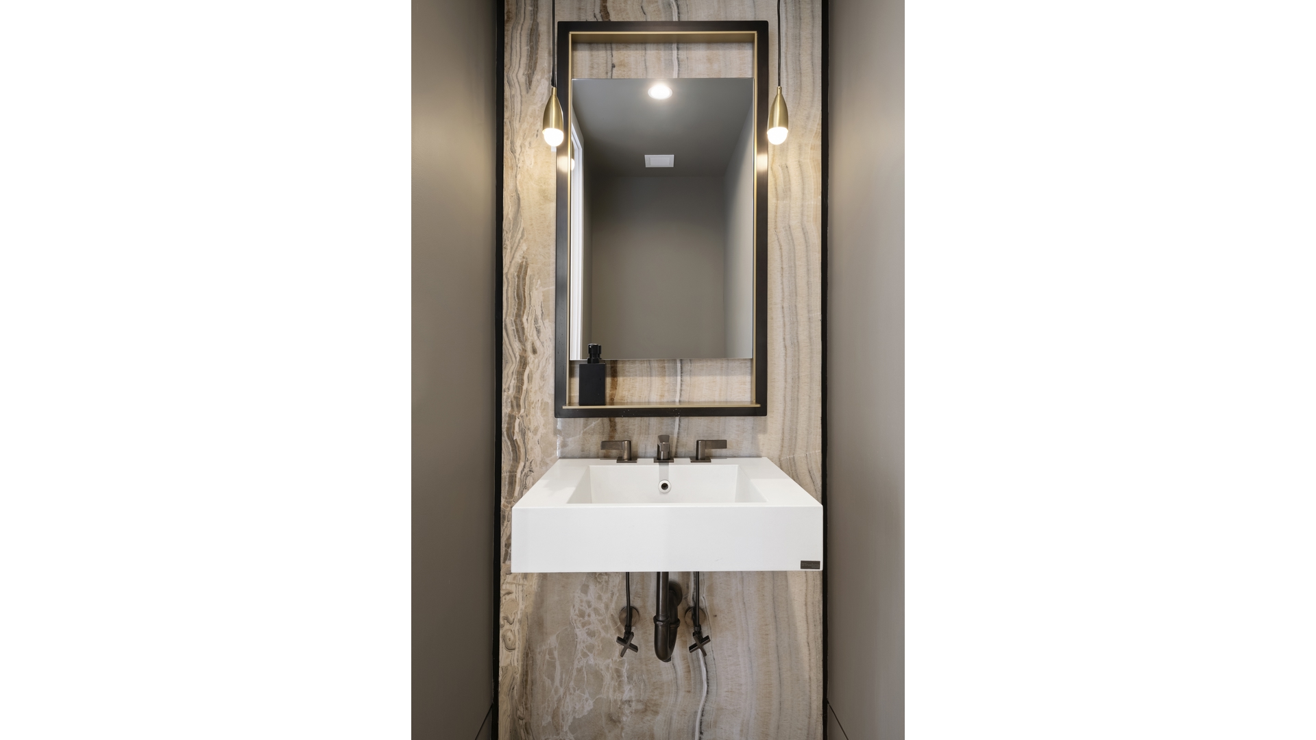 91 Leonard Street, Unit PH1 Manhattan, NY 10013 - Photo 4 of 25 a bathroom with a sink and mirror