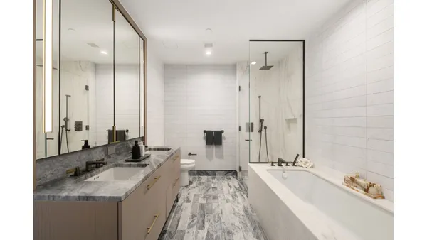 a bathroom with a sink and mirror
