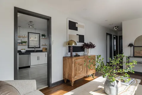 a kitchen with cabinets stainless steel appliances and a counter space