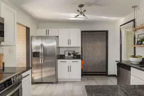 a view of a plant in a vase of the sitting area