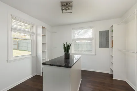an aerial view of residential houses with outdoor space and street view