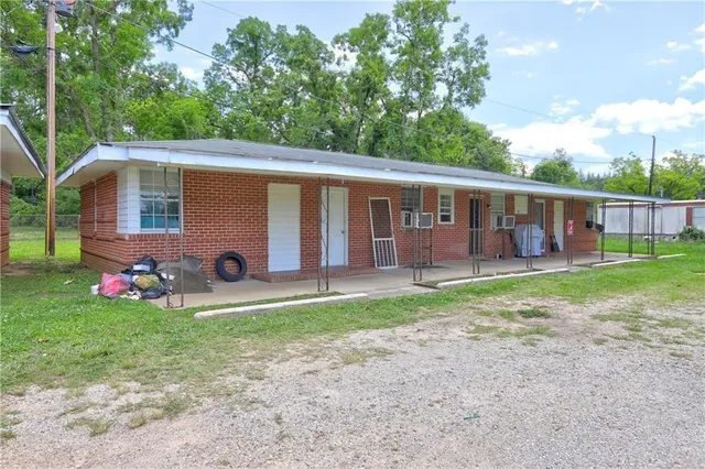 a view of a yard and a house