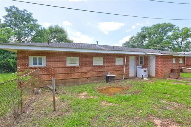 a backyard of a house with seating space