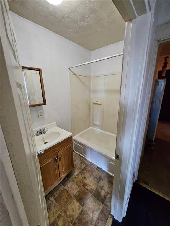 1907 Delaware Avenue, Unit 1 Pittsburgh, PA 15218 - Photo 12 of 12 a bathroom with a sink a toilet and shower