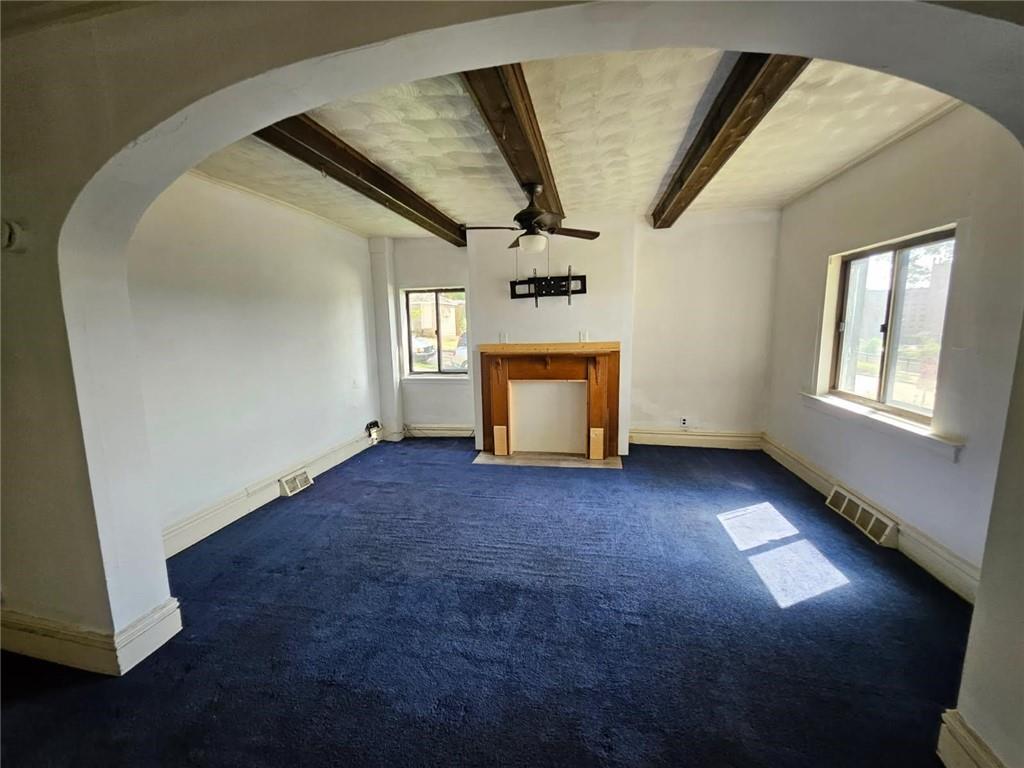 1907 Delaware Avenue, Unit 1 Pittsburgh, PA 15218 - Photo 2 of 12 a view of empty room with window and fireplace