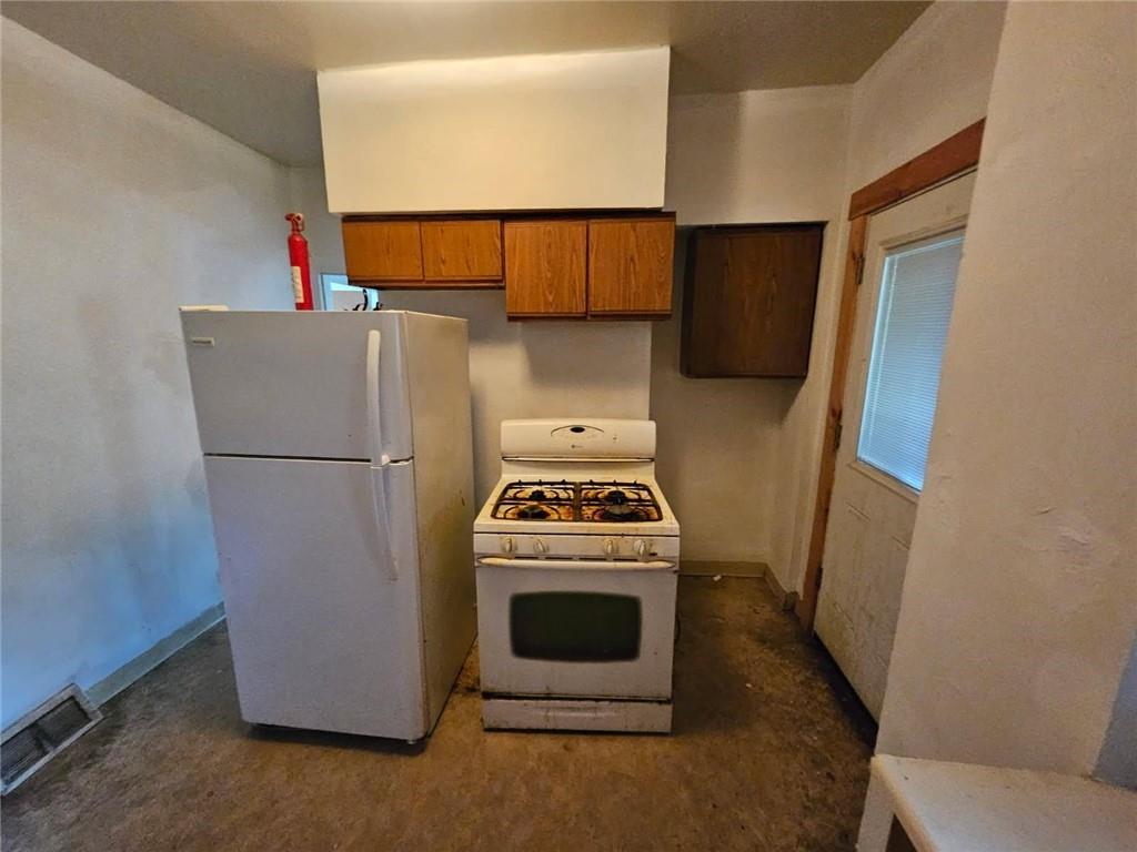 1907 Delaware Avenue, Unit 1 Pittsburgh, PA 15218 - Photo 6 of 12 a stove top oven sitting inside of a kitchen