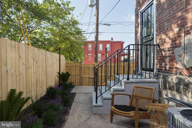a view of a brick buildings with many windows