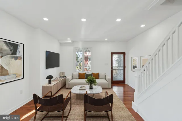 a view of an entryway with wooden floor