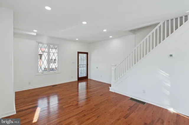 a kitchen with stainless steel appliances a refrigerator sink and microwave
