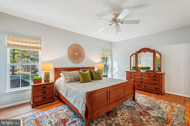 a picture of a room with a white wall and a refrigerator