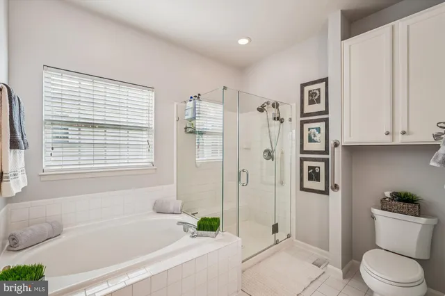 a spacious bedroom with two beds and a large window