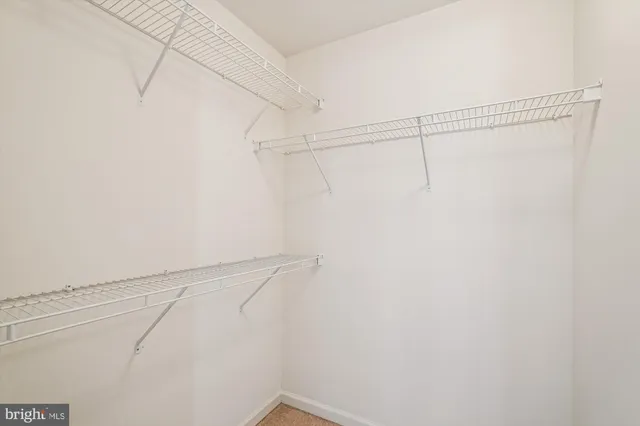 a workspace with furniture and white wall