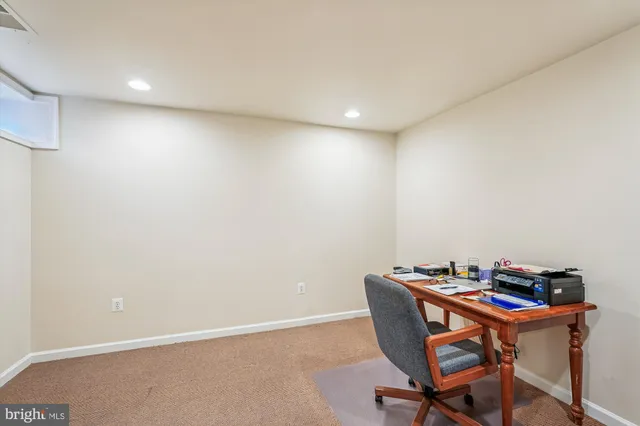 aerial view of a house with a garden and lake view