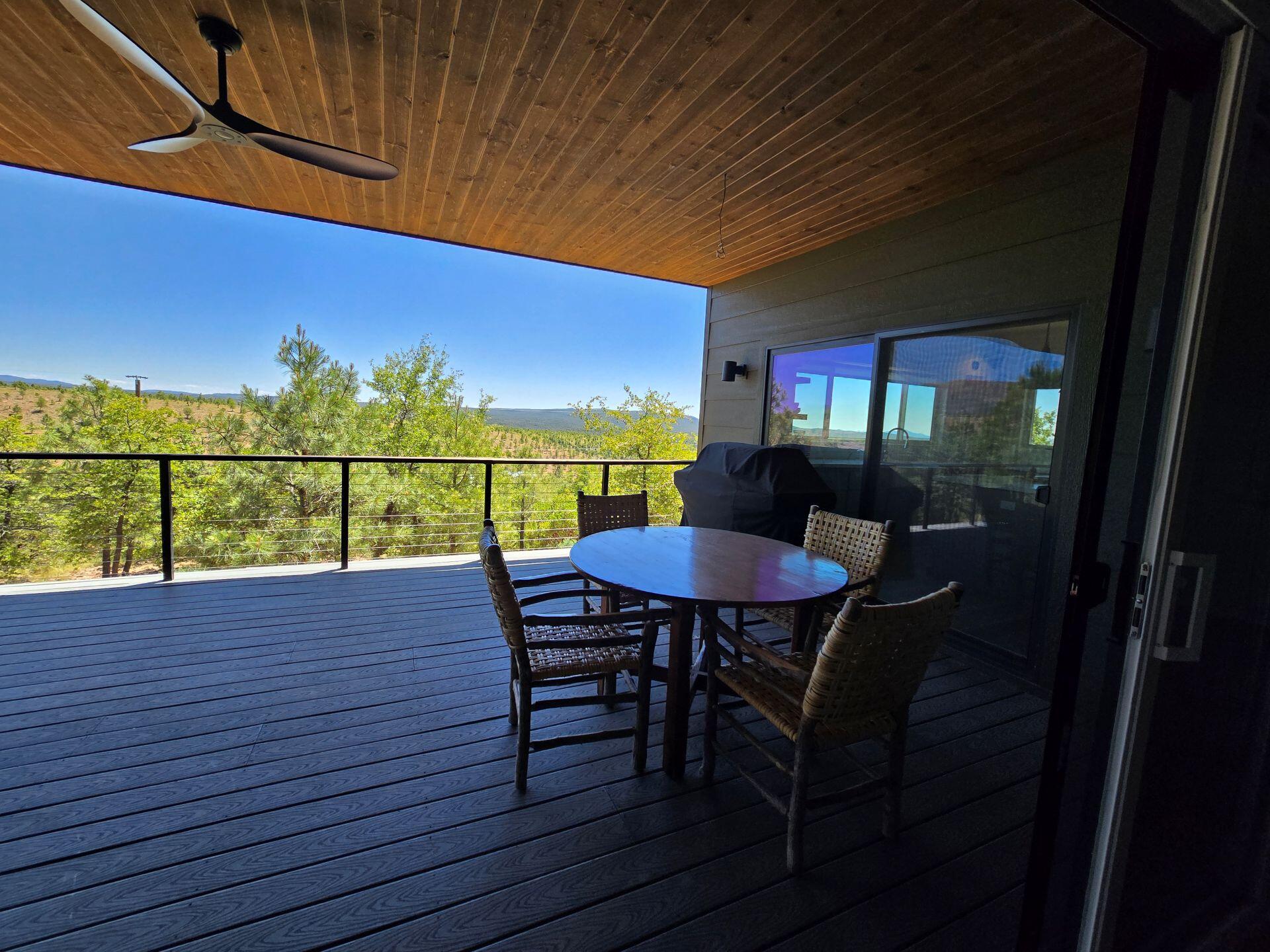 240 Rockinghorse Bend Road Payson, AZ 85541 - Photo 38 of 53 a view of a chairs and table on the wooden roof deck