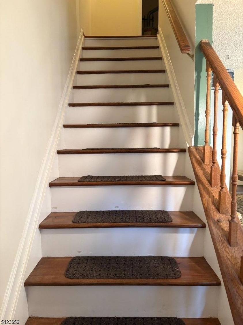 28 Rutgers Drive Newark, NJ 07103 - Photo 18 of 22 a view of staircase with wooden floor