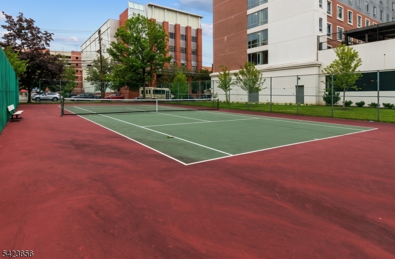 28 Rutgers Drive Newark, NJ 07103 - Photo 19 of 22 a view of a tennis ground with large trees