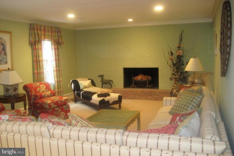 1310 Merrie Ridge Road McLean, VA 22101 - Photo 5 of 30 a living room with furniture and a fireplace