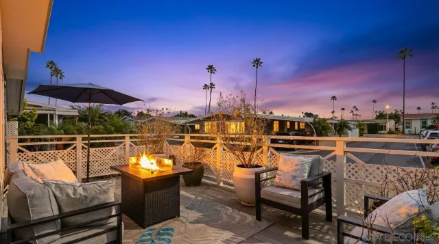 a view of a patio with couches chairs
