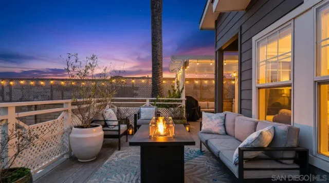 a balcony with furniture and outdoor seating