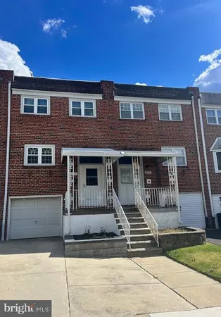 a front view of a house with stairs