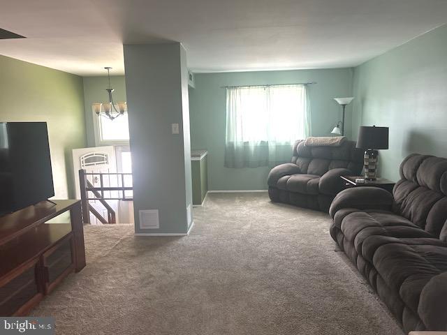 12159 Aster Road Philadelphia, PA 19154 - Photo 2 of 14 a living room with furniture and a flat screen tv