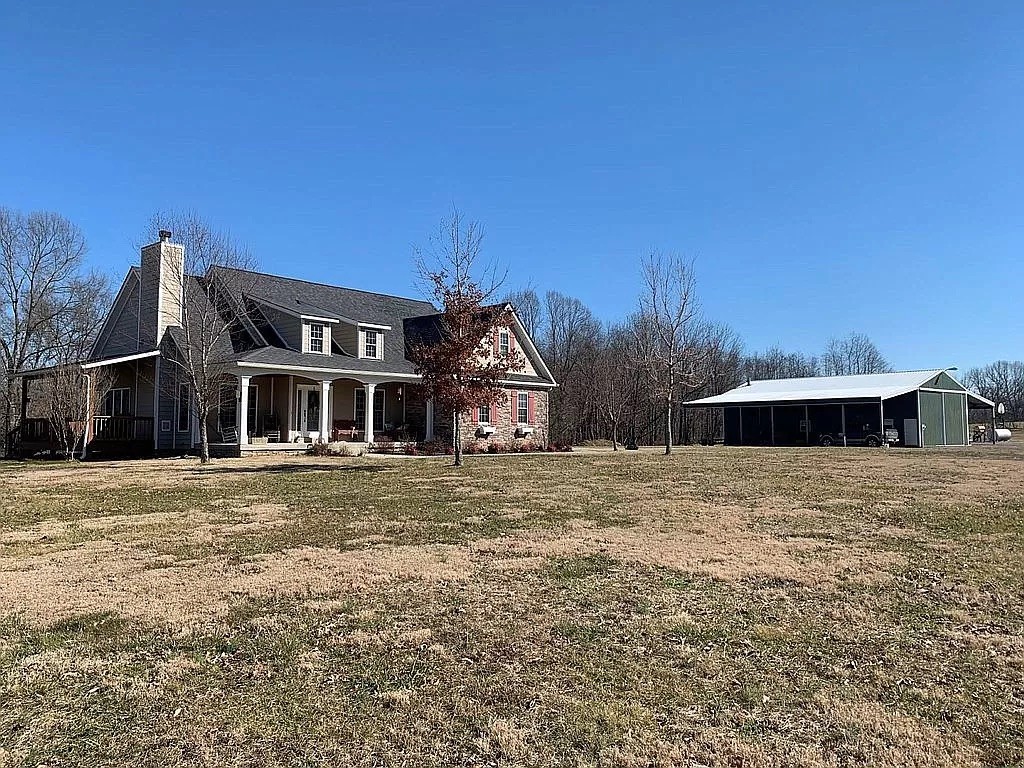3685 South Hyde Road Springfield, TN 37172 - Photo 1 of 26 a front view of a house with a yard and garage