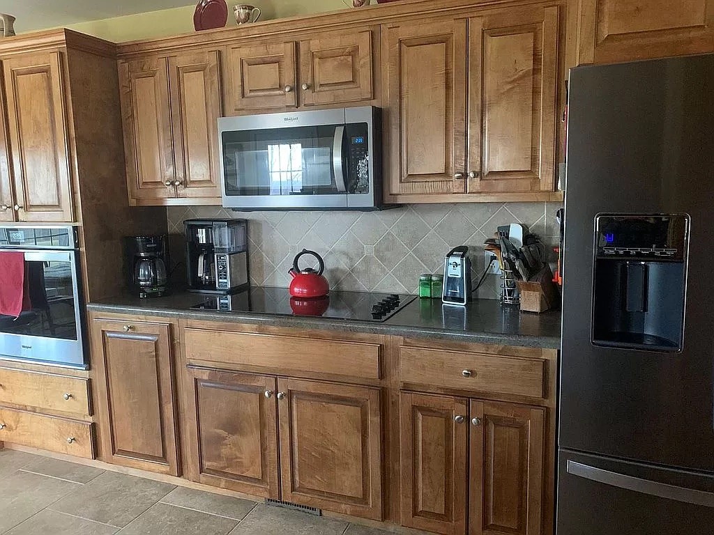 3685 South Hyde Road Springfield, TN 37172 - Photo 12 of 26 a kitchen with stainless steel appliances granite countertop a refrigerator and cabinets