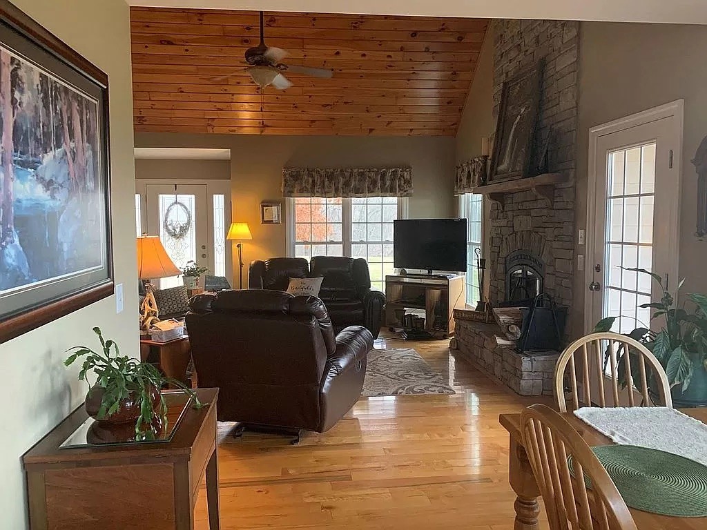 3685 South Hyde Road Springfield, TN 37172 - Photo 10 of 26 a living room with furniture a flat screen tv and a fireplace