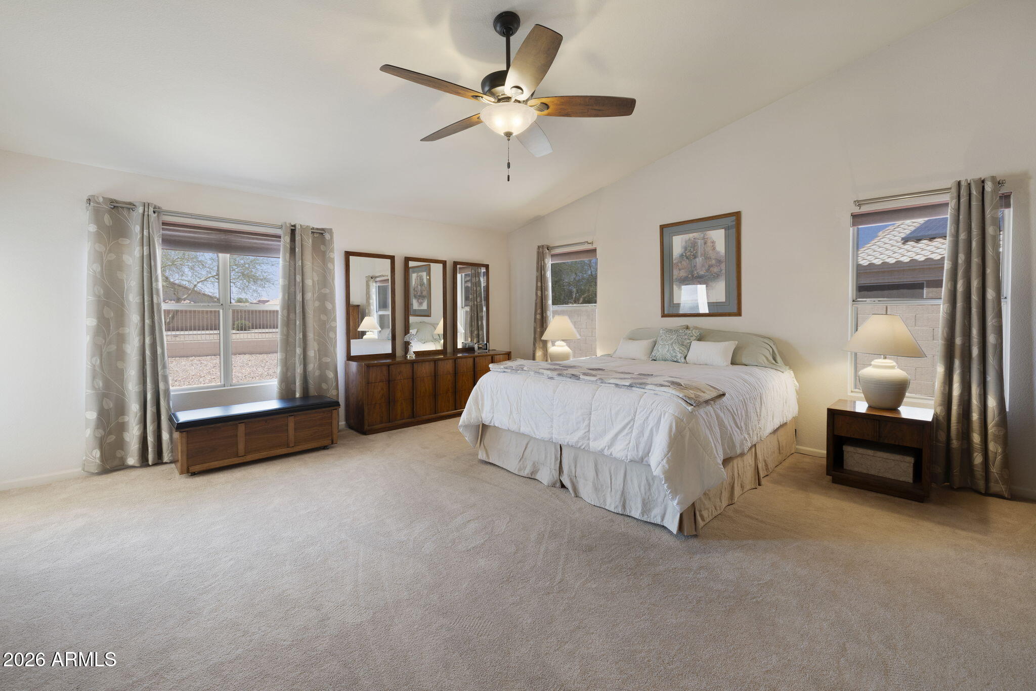 12435 West Monte Vista Road Avondale, AZ 85392 - Photo 34 of 69 a spacious bedroom with a bed and a walk in closet