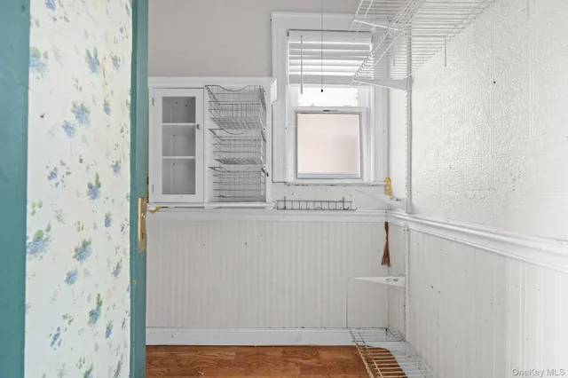 a bathroom with a window and shower