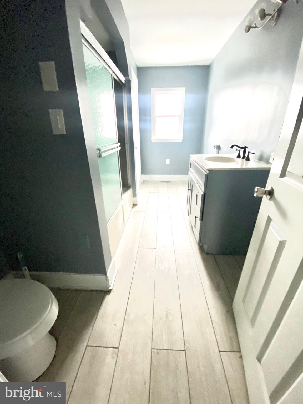 1163 Cotton Street Reading, PA 19602 - Photo 11 of 25 a view of bathroom with a toilet and a mirror